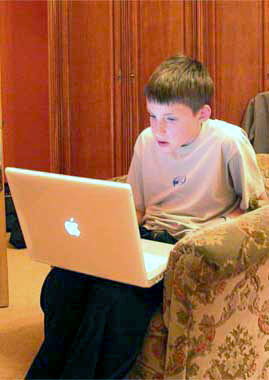 Boy on laptop at home